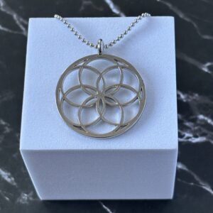 Bijou pendentif Graine de Vie en cuivre argenté – géométrie sacrée et énergie positive