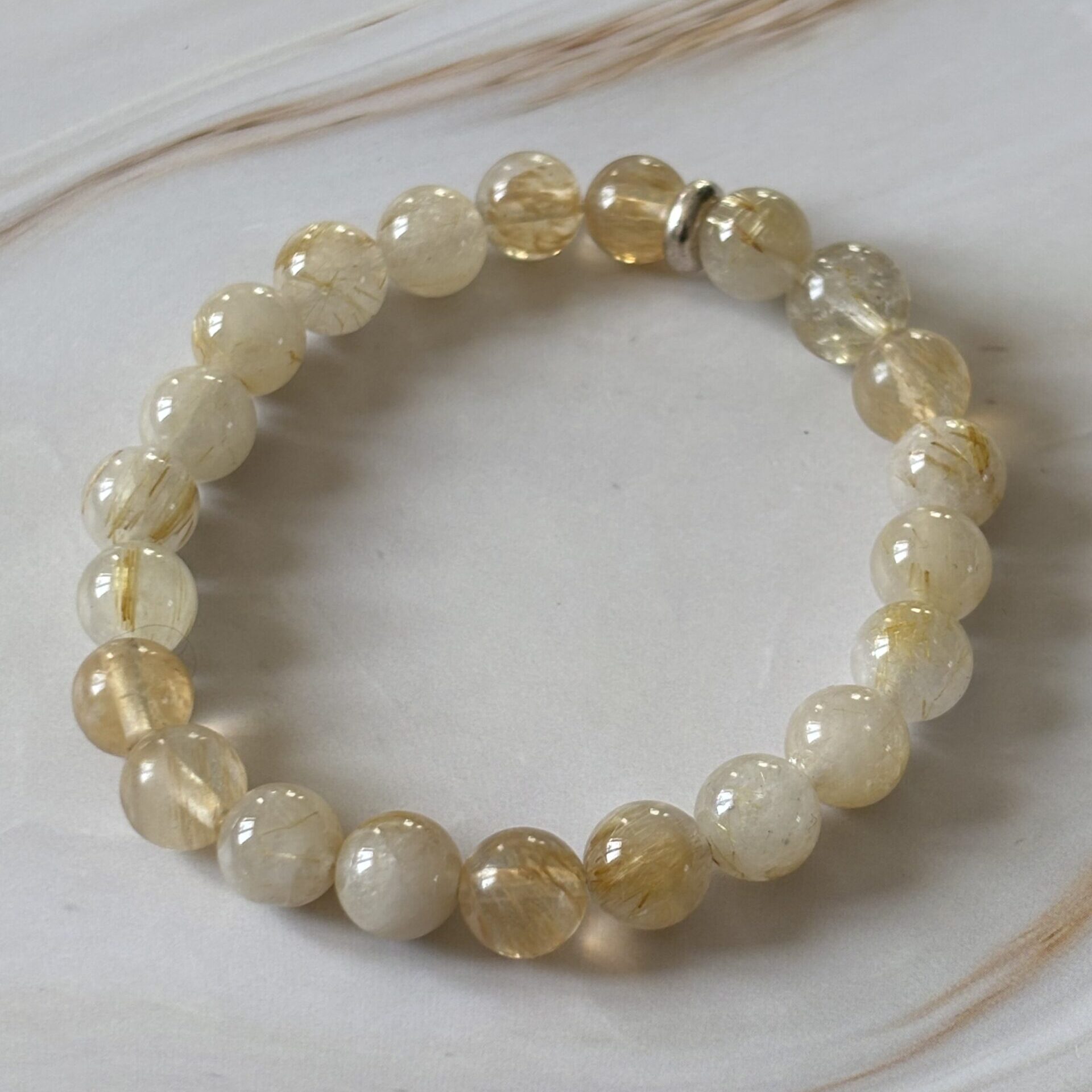 Bracelet Quartz Rutile artisanal — perles naturelles avec aiguilles dorées