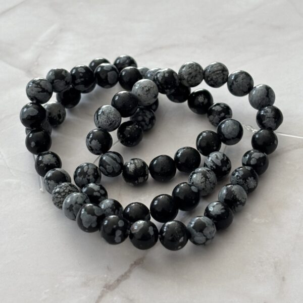 Perles rondes d’obsidienne neige, minéral noir et blanc unique
