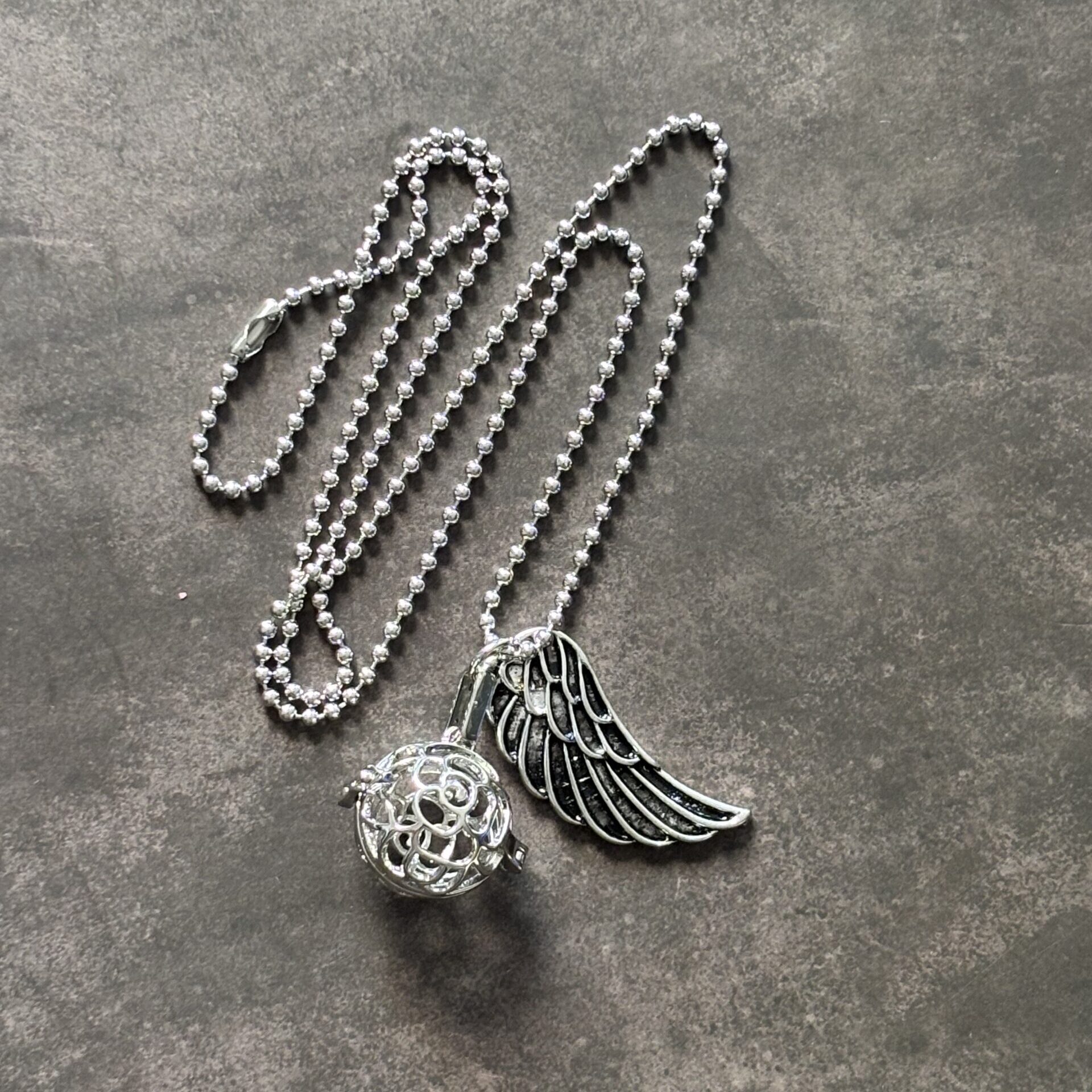 Bola de maternité avec cage pierre naturelle pour apaisement et bien-être