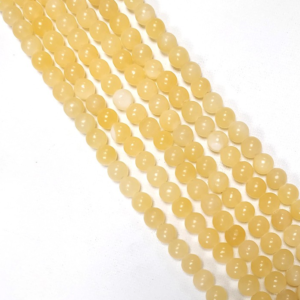 perles naturelles de calcite jaune à l'unité, en lot ou fil ou rang complet