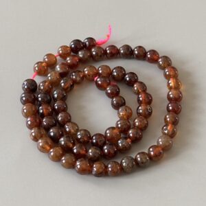 perles 6 mm en grenat hessonite aux nuances brunes et orangées pour loisirs créatifs