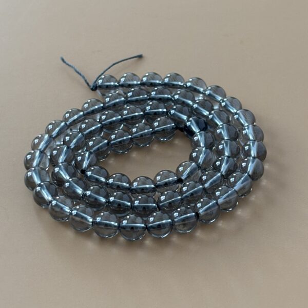 Perles aqua aura gris polies 6 mm au reflet argenté
