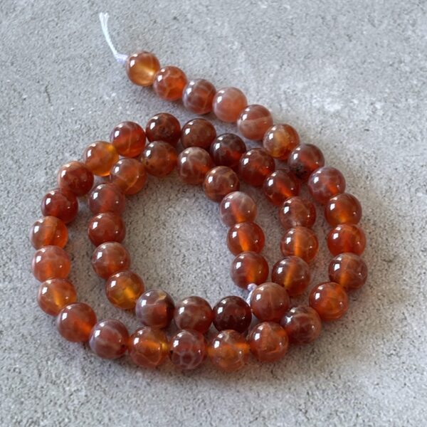 Perles rondes 8 mm agate feu pour bijoux énergétiques et ancrage puissant