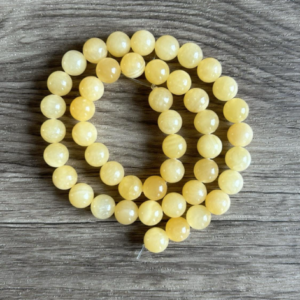 Perles naturelles de calcite en 6 ou 8 mm, vendues à l'unité, en lot ou fil complet