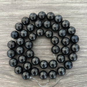 Jais naturel en perles de 6 ou 8 mm vendu à l'unité, en lot ou fil complet