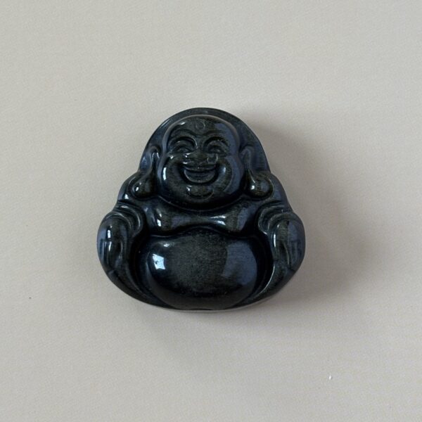 bouddha sculpté en obsidienne dorée