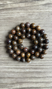 Bronzite naturelle perles 6 ou 8 mm vendues à l'unité, en lot ou fil ou rang complet