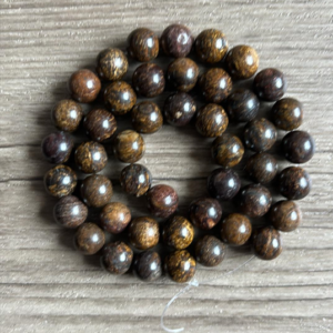 Bronzite naturelle perles 6 ou 8 mm vendues à l'unité, en lot ou fil ou rang complet