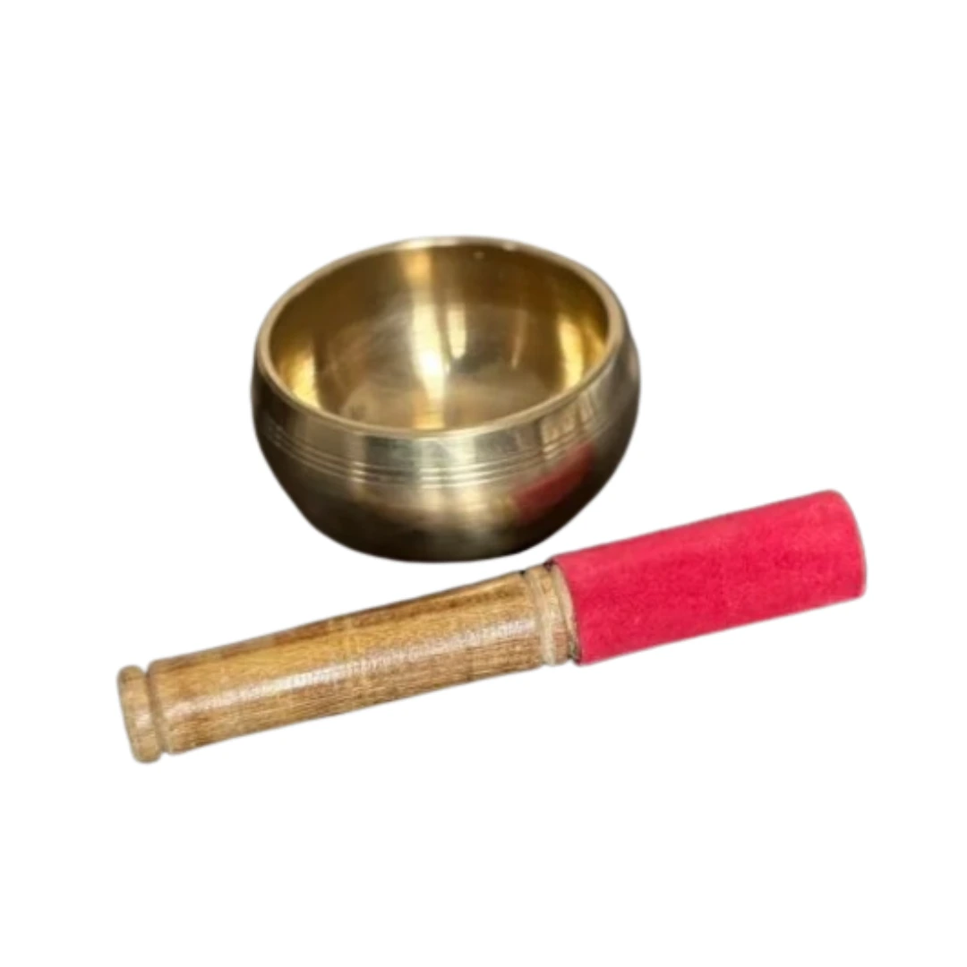 Bol tibétain de méditation avec maillet en bois, instrument traditionnel utilisé pour la relaxation, le bien-être et les séances de méditation.