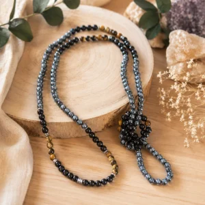 Collier long artisanal en pierres naturelles hématite, œil de tigre et agate noire 6 mm